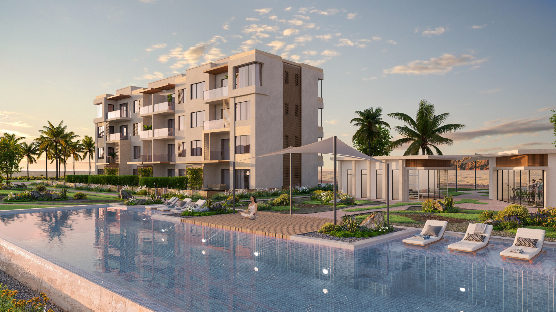 Solaris community pool at sunset in Jebel Sifah, Oman